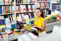 Woman standing with open in publishers store