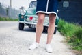 Woman standing outside by classic car Royalty Free Stock Photo