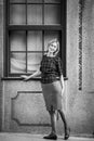 A woman standing outside a house in Porto, Portugal. . Royalty Free Stock Photo