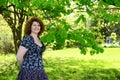 Woman standing in park near the chestnut