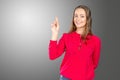 Woman standing pointing her finger Royalty Free Stock Photo