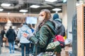 Woman standing in queue at cash desk in supermarket wearing mask Royalty Free Stock Photo