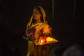 Woman standing in river water at chhat puja