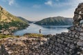 Woman Standing among Ruins of Ancient Fortress Royalty Free Stock Photo