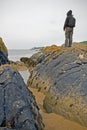 Woman standing by sea