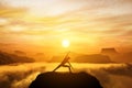 Woman standing in side angle yoga position, meditating