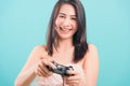 Woman standing smile lifestyle games technology her holding joystick game playing on-hands