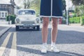 Woman standing in stret with classic car Royalty Free Stock Photo