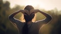 Woman standing with their back to the camera making a heart with their arms