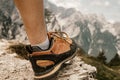 Woman standing at the top of the hill in mountains looking at wonderful scenery. Triglav, the highest slovenian mountain. Trgilav