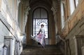 Woman standing on the top of a stairway