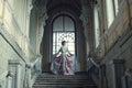 Woman standing on the top of a stairway