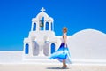 Woman standing by the traditional greek church Royalty Free Stock Photo