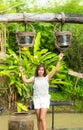 Woman standing under Stainless steel water tanks that hung on a