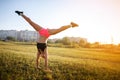 Woman Standing upside down on the evening workout Royalty Free Stock Photo