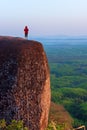 Woman standing watching on the three whale rock mountain at Bueng Kan Province,Thailand