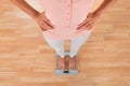 Woman Standing On Weighing Scale Royalty Free Stock Photo