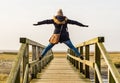 Woman is standing on wooden bridge Royalty Free Stock Photo