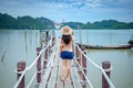 A woman standing on a wooden jetty bridge at Talet bay Royalty Free Stock Photo