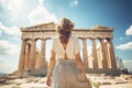 A woman stands in awe in front of the iconic Parthenon in Greece, marveling at its ancient beauty, Female tourist standing in