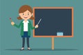 A woman stands in front of a blackboard holding a pointer, ready to teach, The teacher stands near the blackboard and holds a Royalty Free Stock Photo