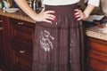 Woman standing in kitchen, on skirt of flour trace palm Royalty Free Stock Photo