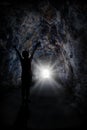 Woman Stands Inside Tunnel With Blinding Light Royalty Free Stock Photo