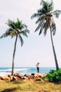 Woman stands at the ocean coast and looks on horizont line Royalty Free Stock Photo