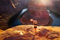 Woman Stands Over the Edge of Horseshoe Bend. Arizona Horseshoe Bend of Colorado River in Grand Canyon. Travel and Royalty Free Stock Photo