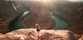 Woman Stands Over the Edge of Horseshoe Bend. Horseshoe Bend, Page, Arizona. Horse Shoe Bend on Colorado River, Grand Royalty Free Stock Photo