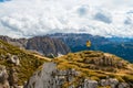 Woman stands on top of Seceda ridgeline taking photos Royalty Free Stock Photo