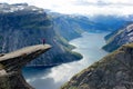 A woman stands on Trolltunga, Norway