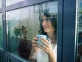 Woman staring at the window Royalty Free Stock Photo