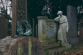 Woman statue leaning on tomb in Dean Cemetery, Edinburgh