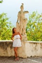 Woman and statue of warrior