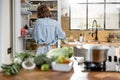 Woman staying back in the beautiful interior kitchen