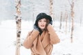 Woman staying warm during a snow storm Royalty Free Stock Photo