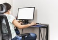 Woman stays home working on computer at home during coronavirus pandemic.