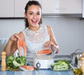 Woman steaming salmon and vegetables Royalty Free Stock Photo