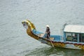 Woman steering dragon boat on Perfume River in Hue Vietnam Royalty Free Stock Photo