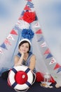 Woman with steering wheel and marine decor Royalty Free Stock Photo