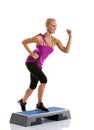 Woman step aerobics exercise Royalty Free Stock Photo