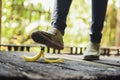 Woman stepping on banana skin or peel, accident concept Royalty Free Stock Photo