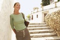 Woman On Steps Leaning On Wall In Granada