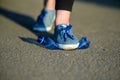 A woman steps on a plastic bottle. The concept of environmental problems Royalty Free Stock Photo