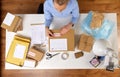 Woman sticking fragile mark to parcel box