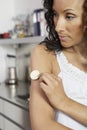 Woman Sticking Nicotine Patch On Arm Royalty Free Stock Photo