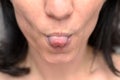 Woman sticking out her tongue at the camera