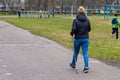 A woman with sticks does Nordic walking at the stadium Royalty Free Stock Photo