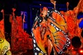 Woman on stilts in beautiful fancy butterfly costume